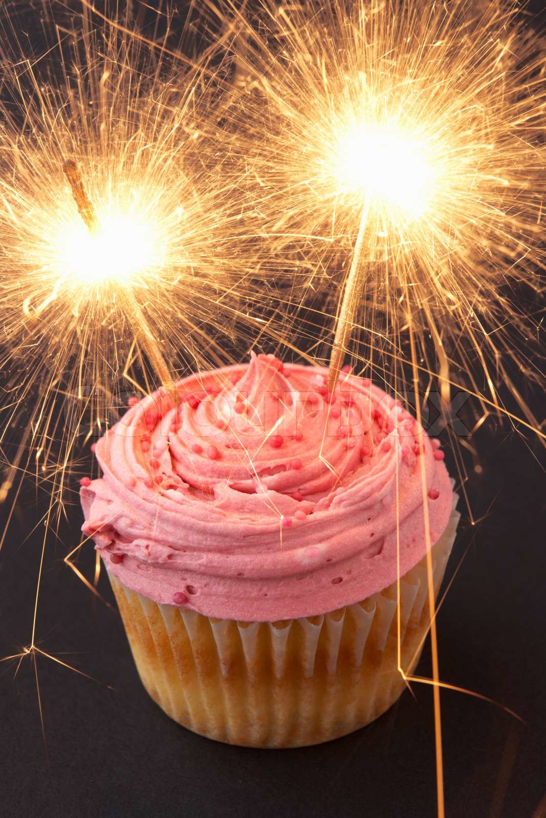 A cupcake with sparklers | Stock image | Colourbox