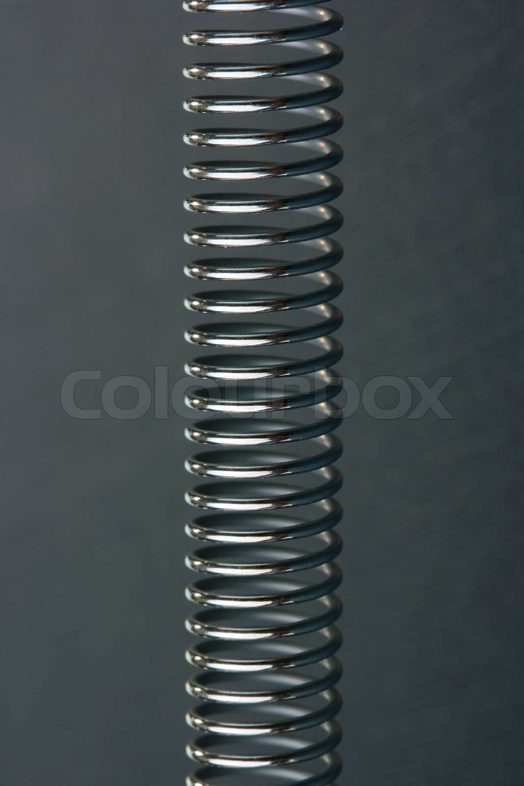 Spiral spring working on a stretching, for various mechanical works