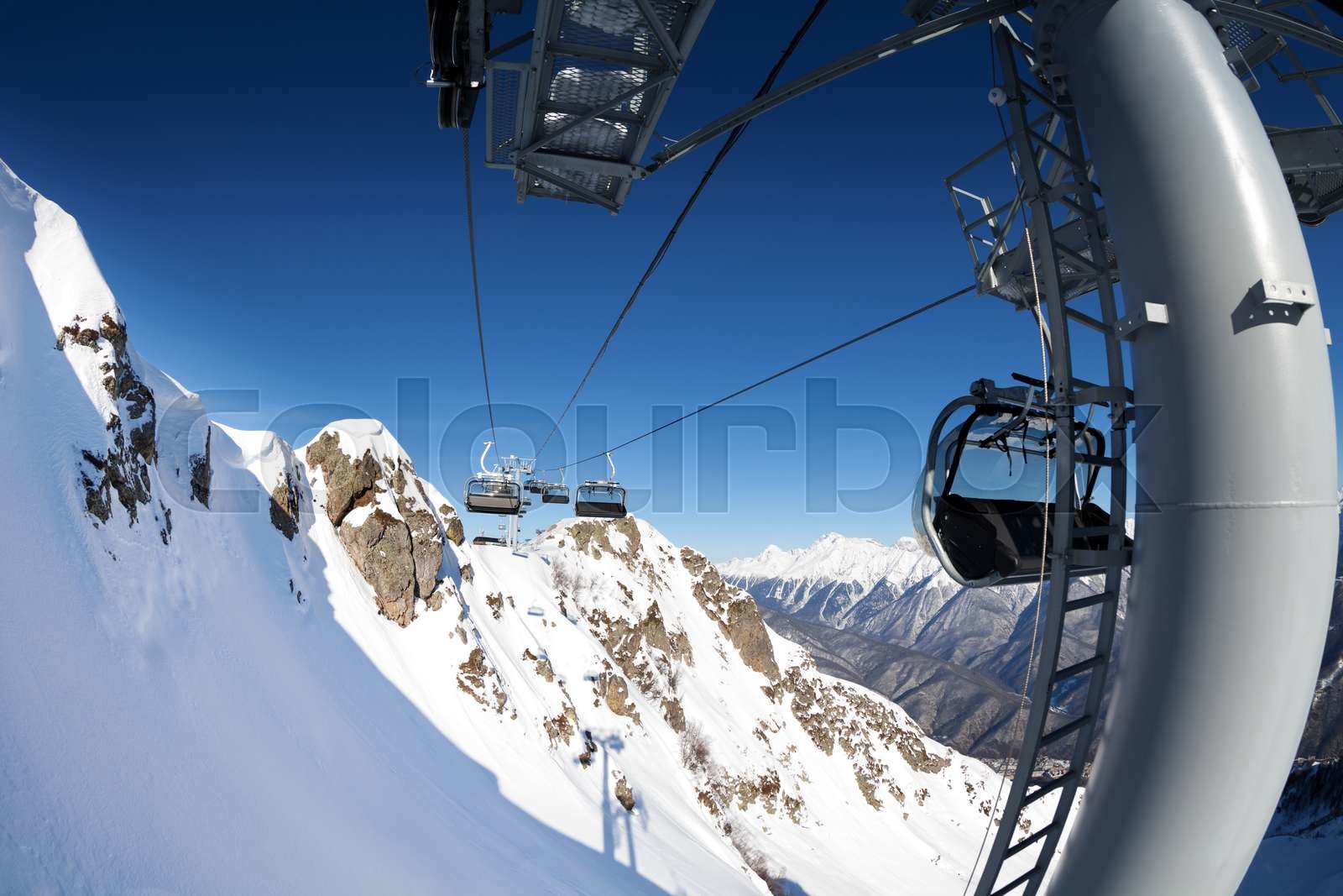 Ski lift panorama on winter resort over valley | Stock image | Colourbox