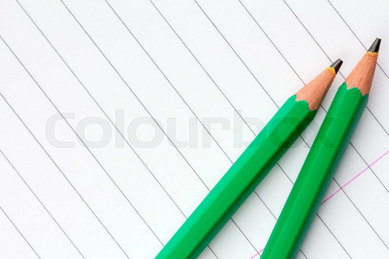 Green Pencils on Lined Paper | Stock image | Colourbox