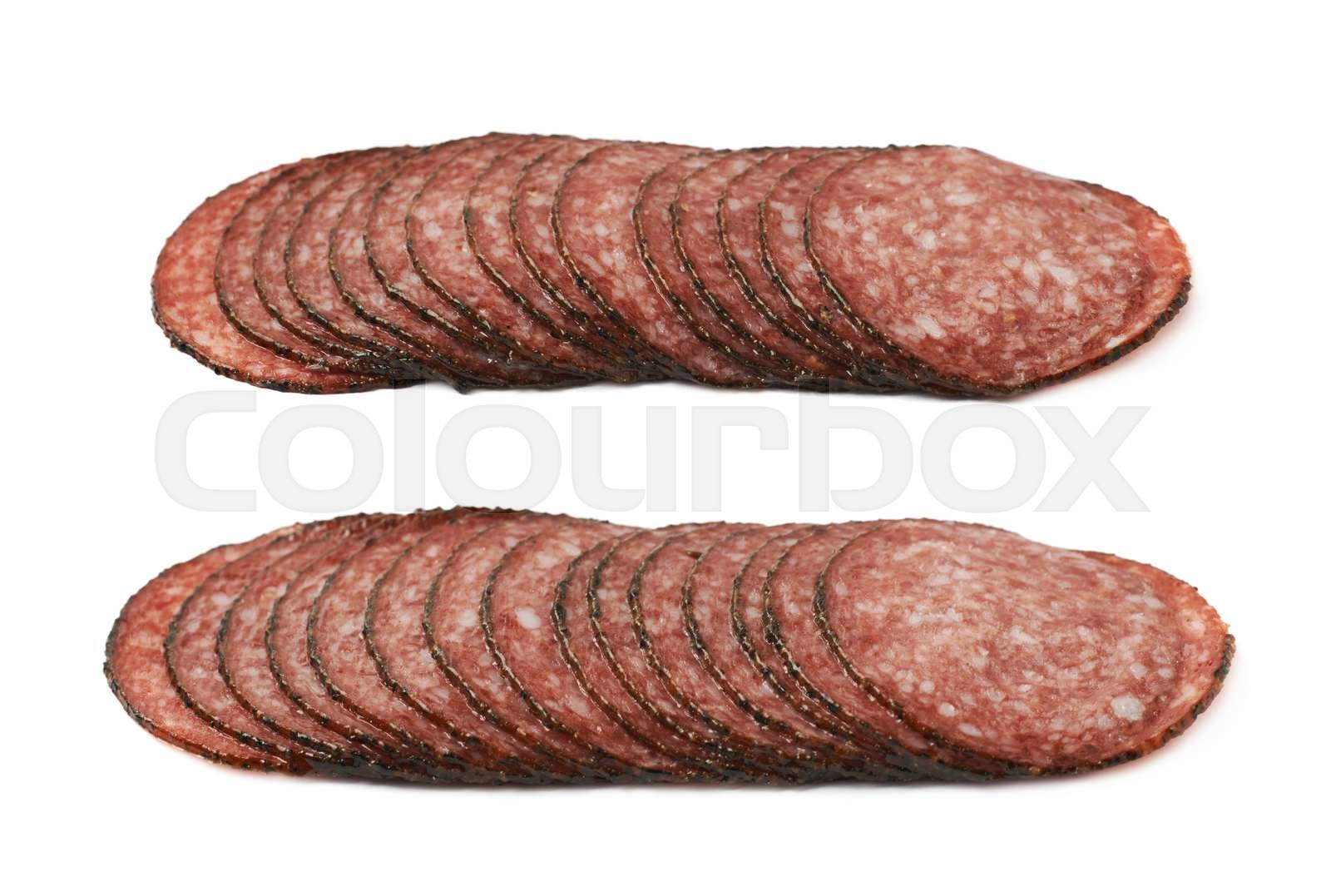 Stack of multiple salami slices isolated Stock image Colourbox