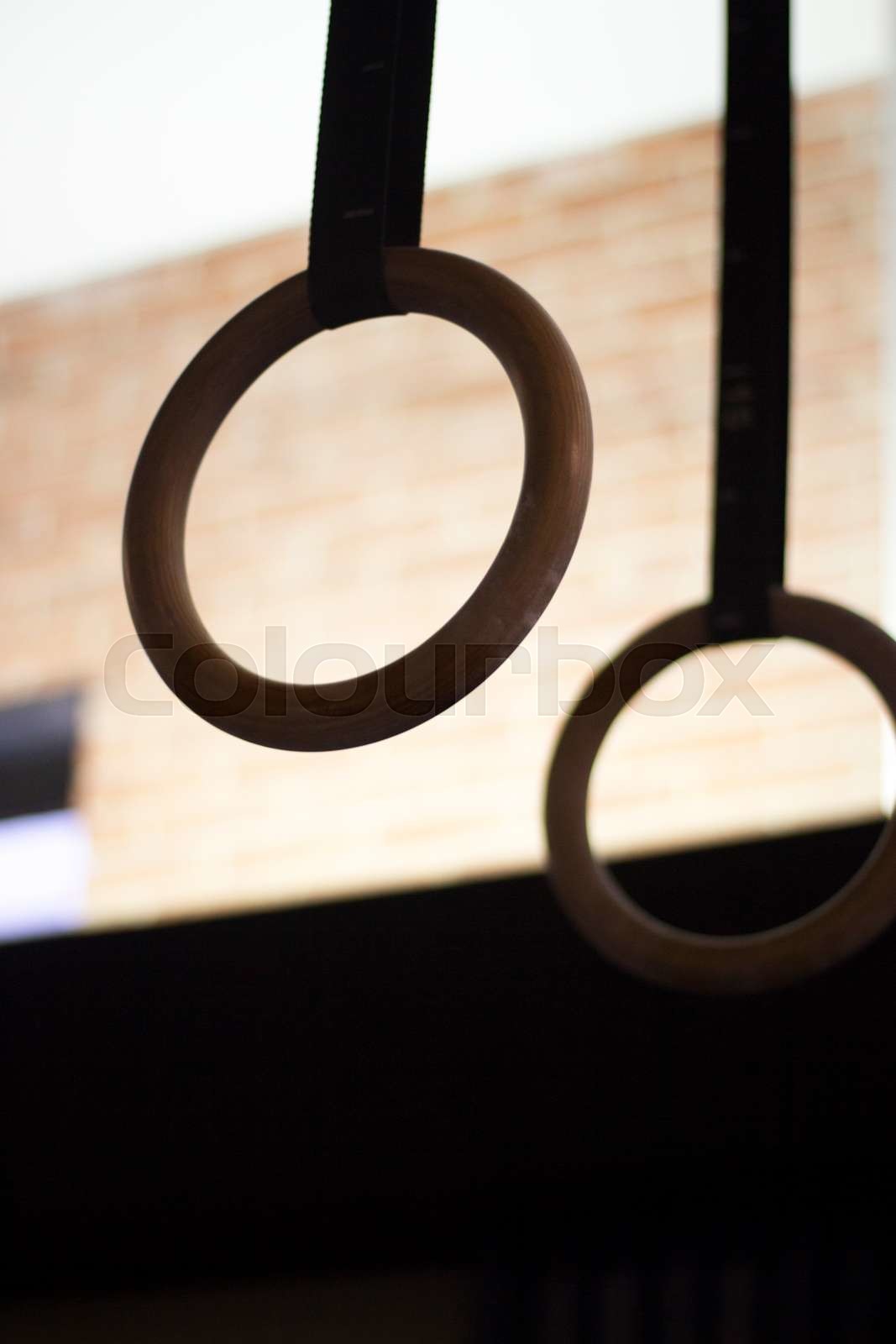 Olympic gymnasium rings in gym Stock image Colourbox