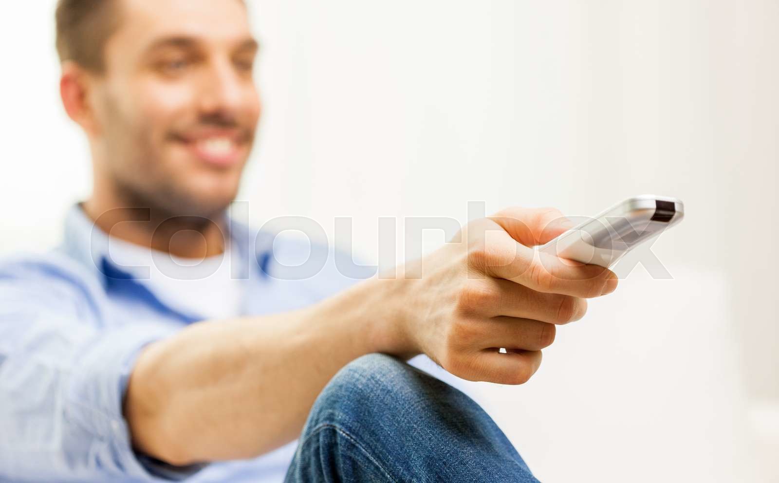 Close Up Of Man With Tv Remote Control At Home Stock Image Colourbox