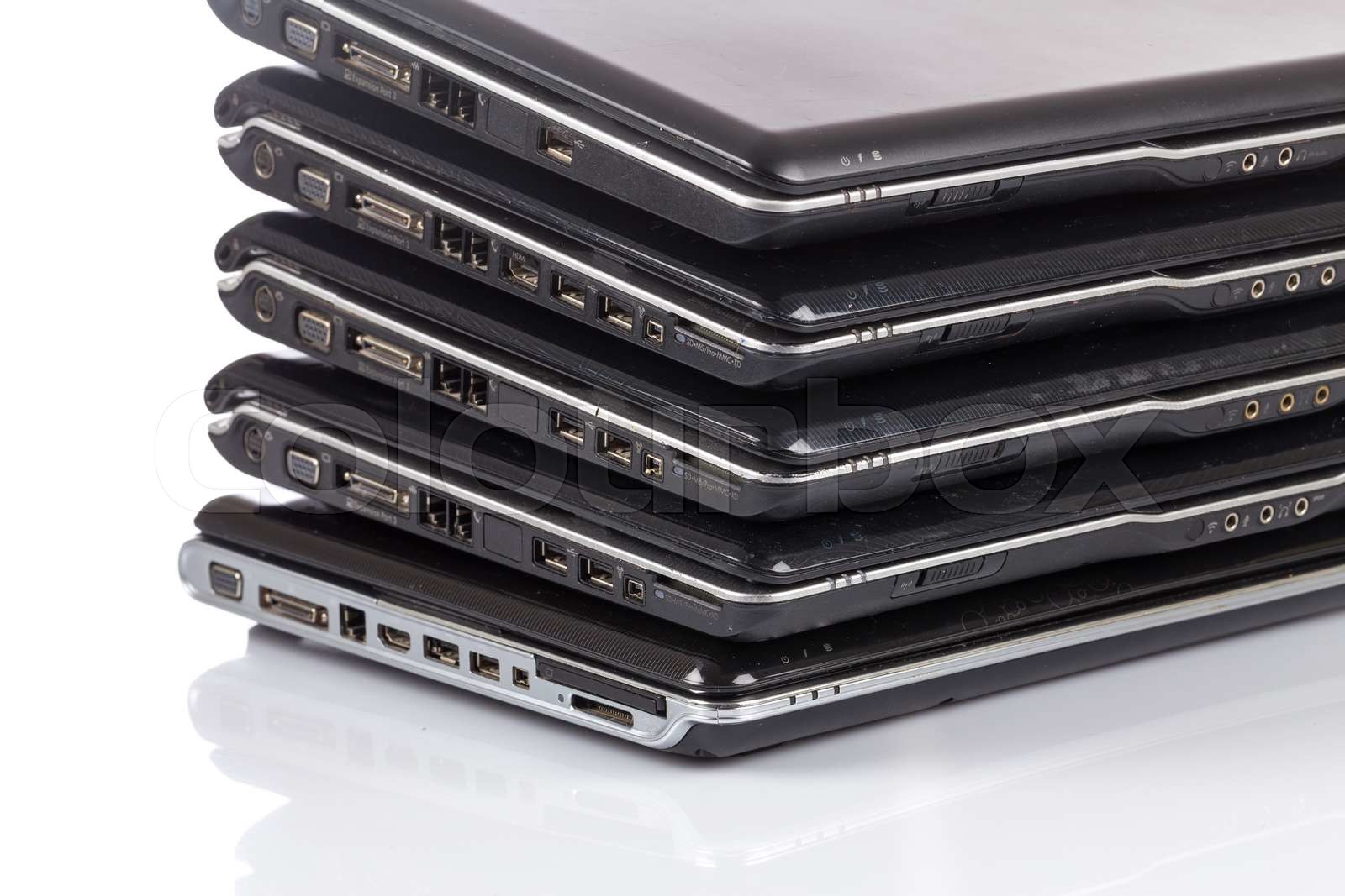 stack of old laptops awaiting repair Stock image Colourbox
