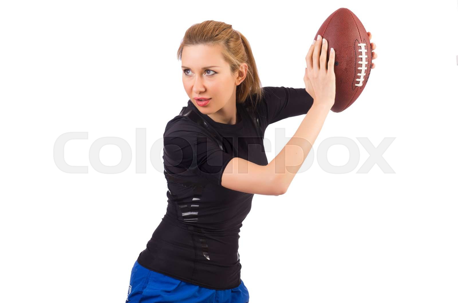 Woman with american football isolated on white | Stock image | Colourbox