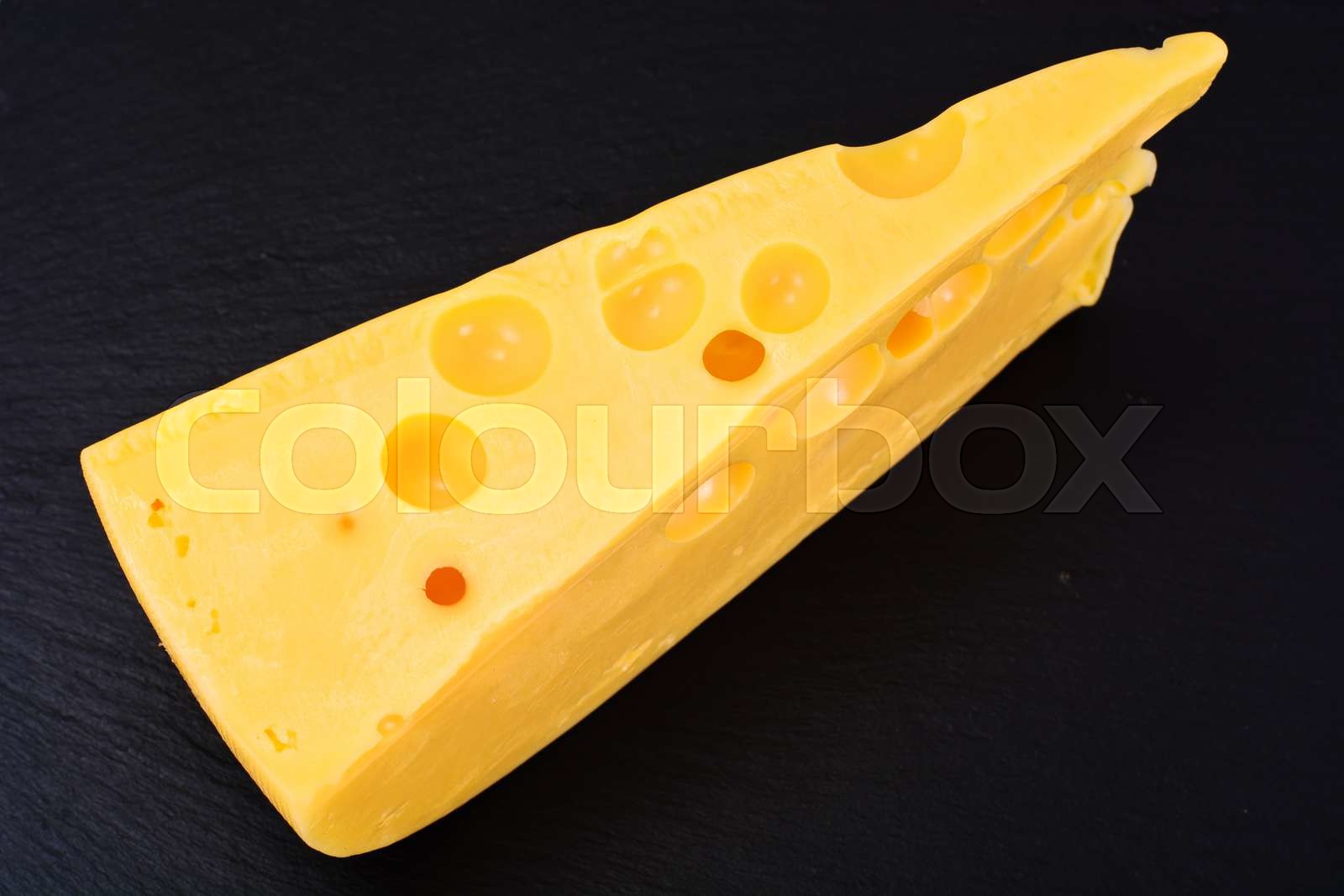 Swiss Cheese Isolated on Black Background Stock image Colourbox