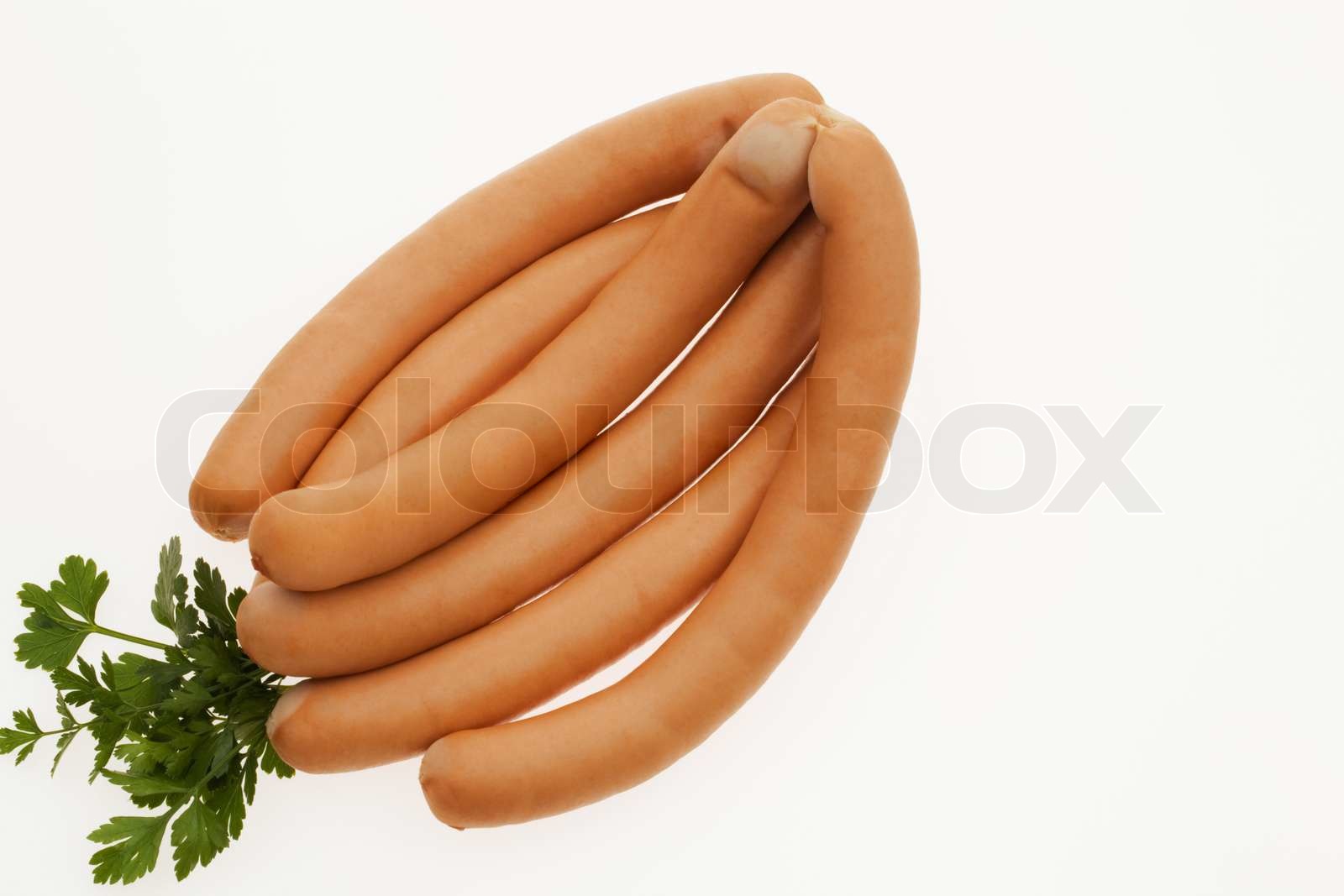 A pair of Vienna sausage on a plate. Frankfurters Stock image Colourbox