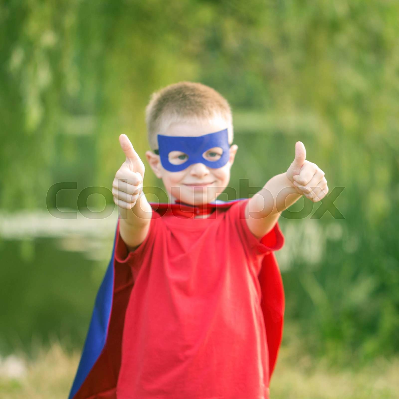 Kid In Super Hero Costume Showing Thumbs Up Stock Image Colourbox Kid In Super Hero Costume Showing Thumbs Up Stock Image Colourbox