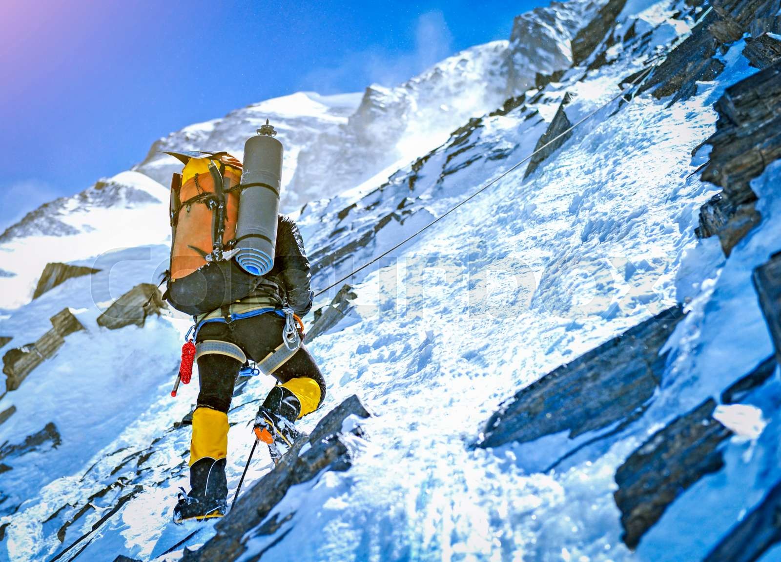 Climber on the snowy mountains Stock image Colourbox