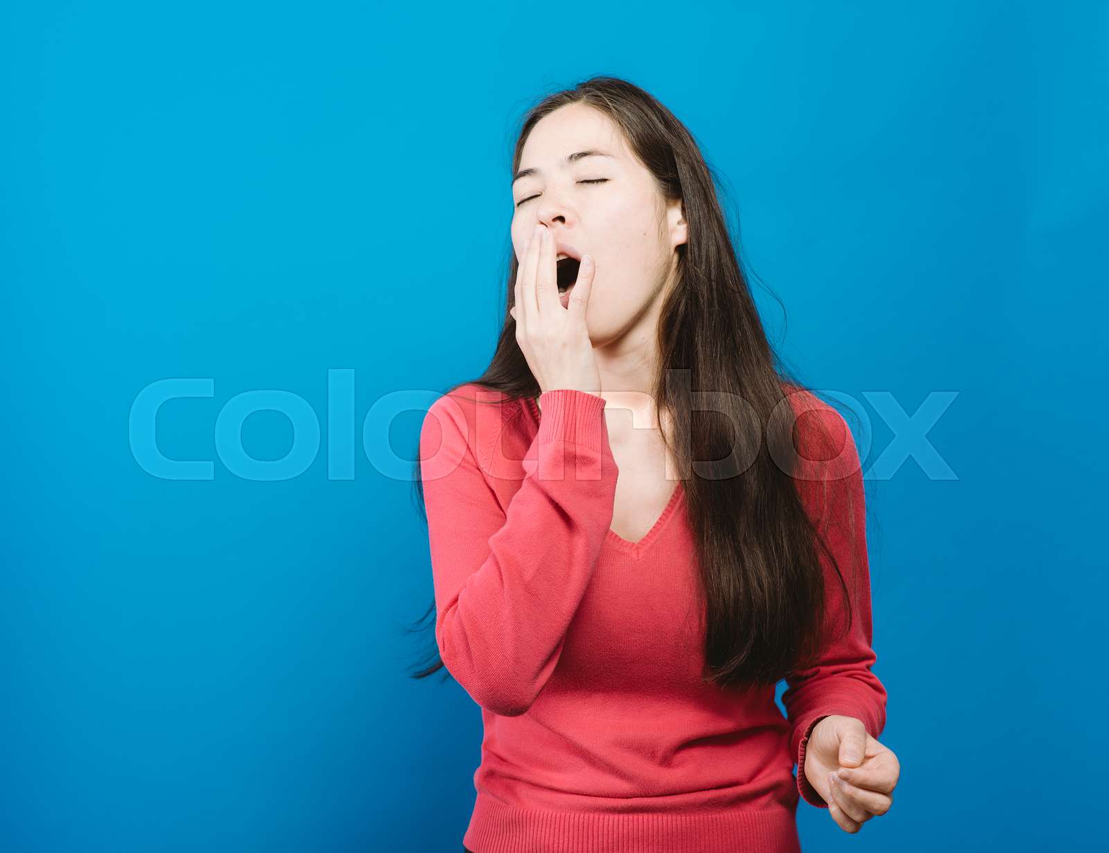 Yawns. Female Stock image Colourbox