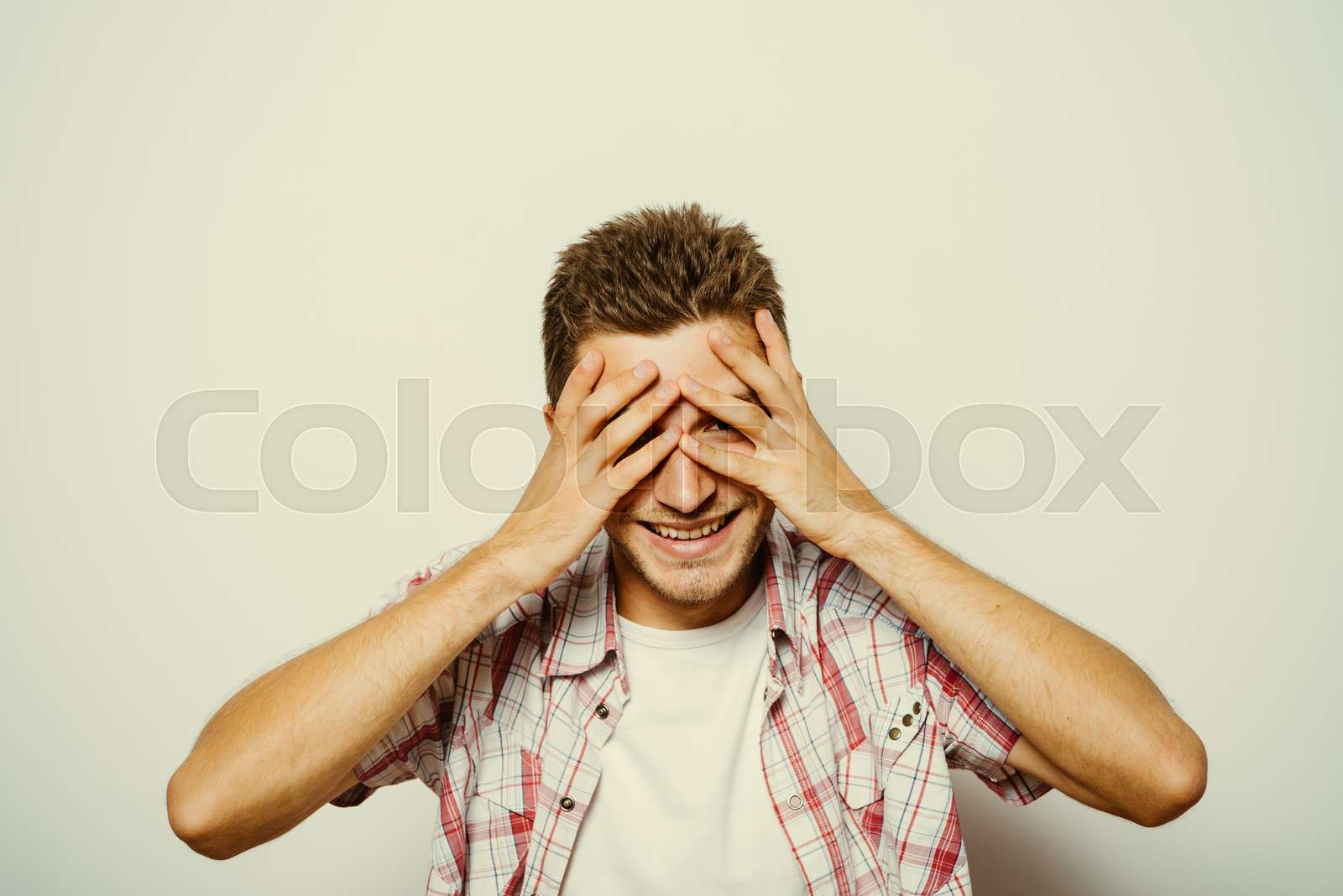 man covered his face with his hands | Stock image | Colourbox