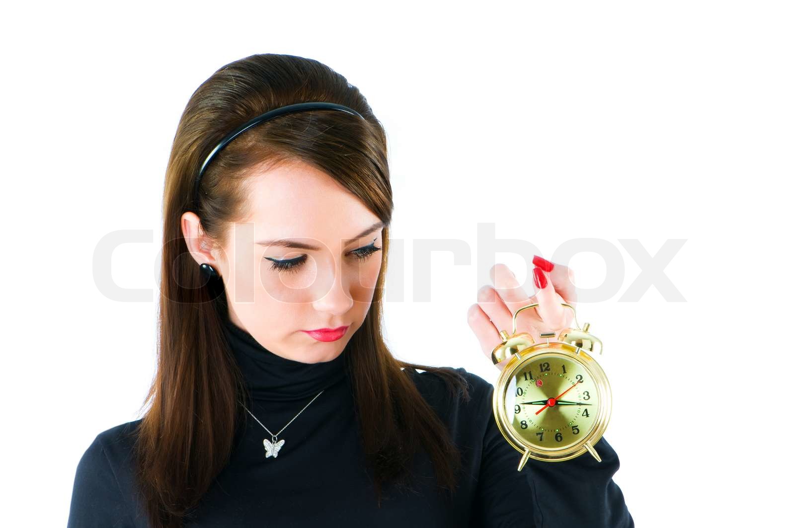 Frau mit Uhr auf dem weißen isoliert Stock Bild Colourbox