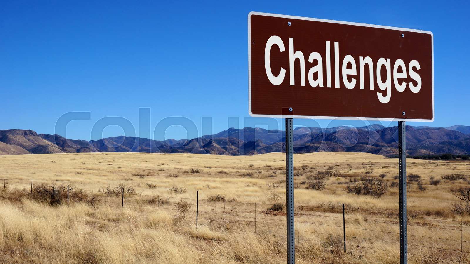 Challenges brown road sign Stock image Colourbox