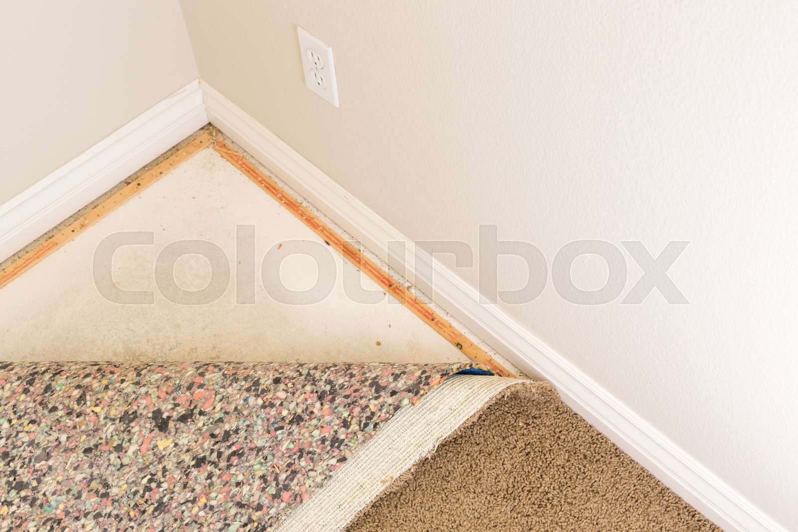 Pulled Back Carpet and Padding In Room Stock image Colourbox