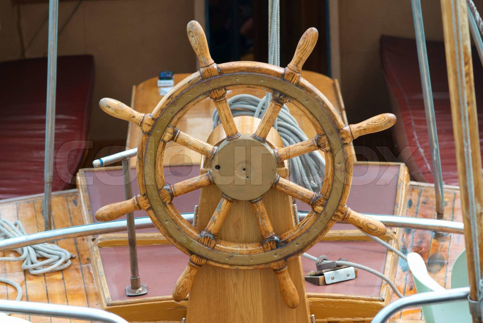 Old wooden steering wheel on the boat Stock image Colourbox