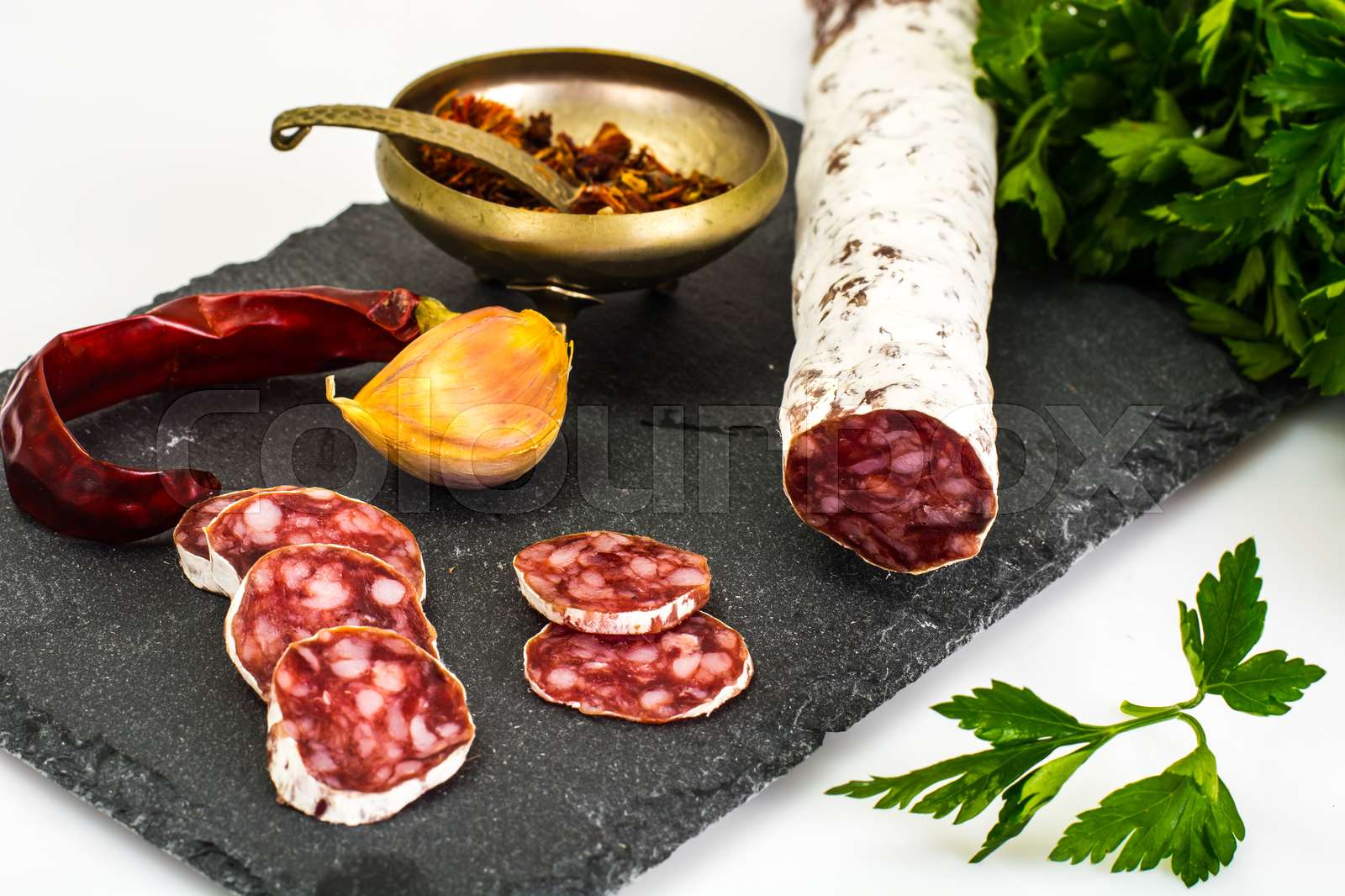 Snack smoked jerky sausage with spices, garlic and parsley Stock