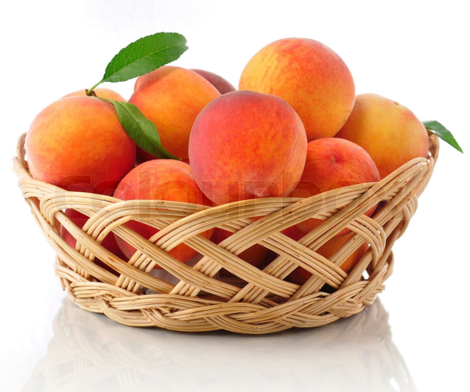 fresh peaches in a basket | Stock image | Colourbox