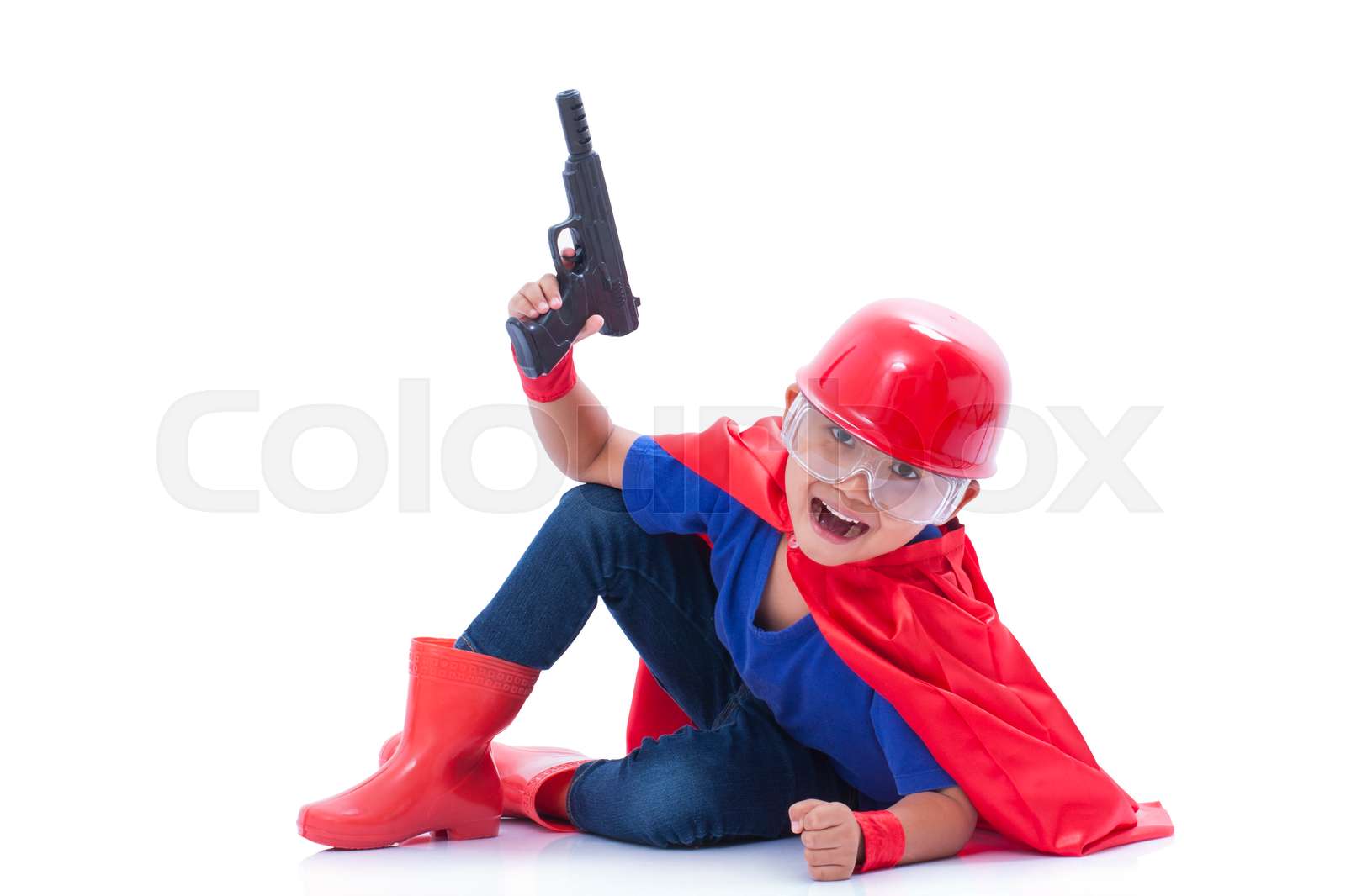 Child pretending to be a superhero | Stock image | Colourbox