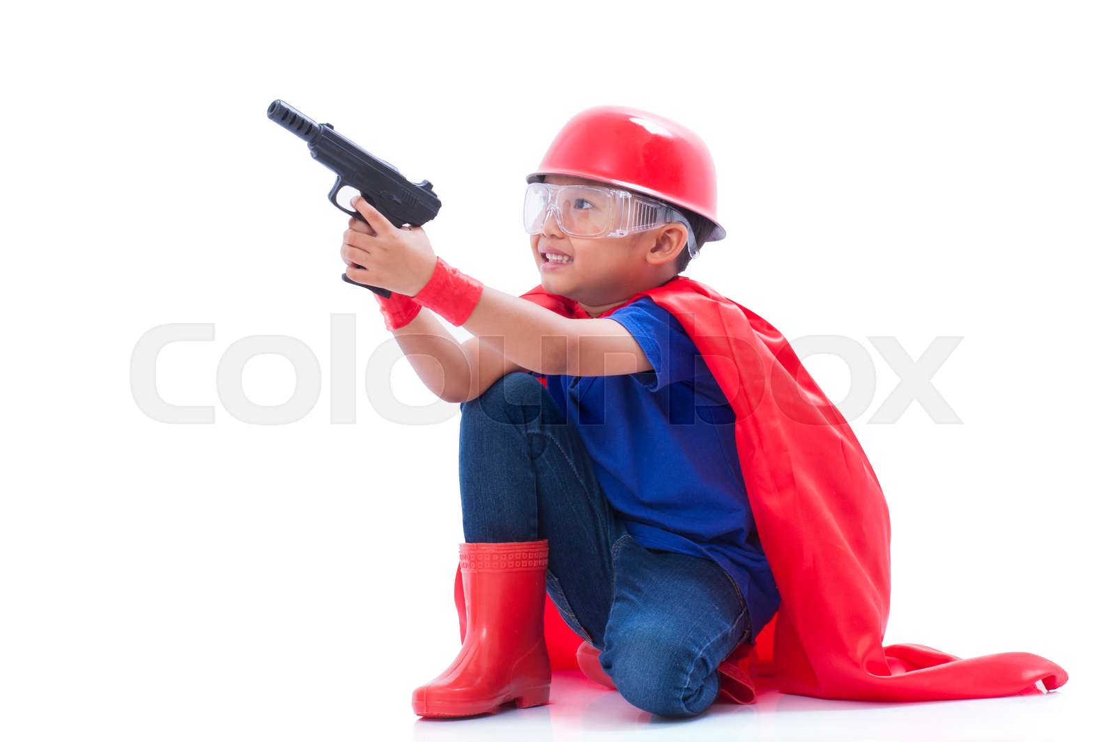Child pretending to be a superhero | Stock image | Colourbox