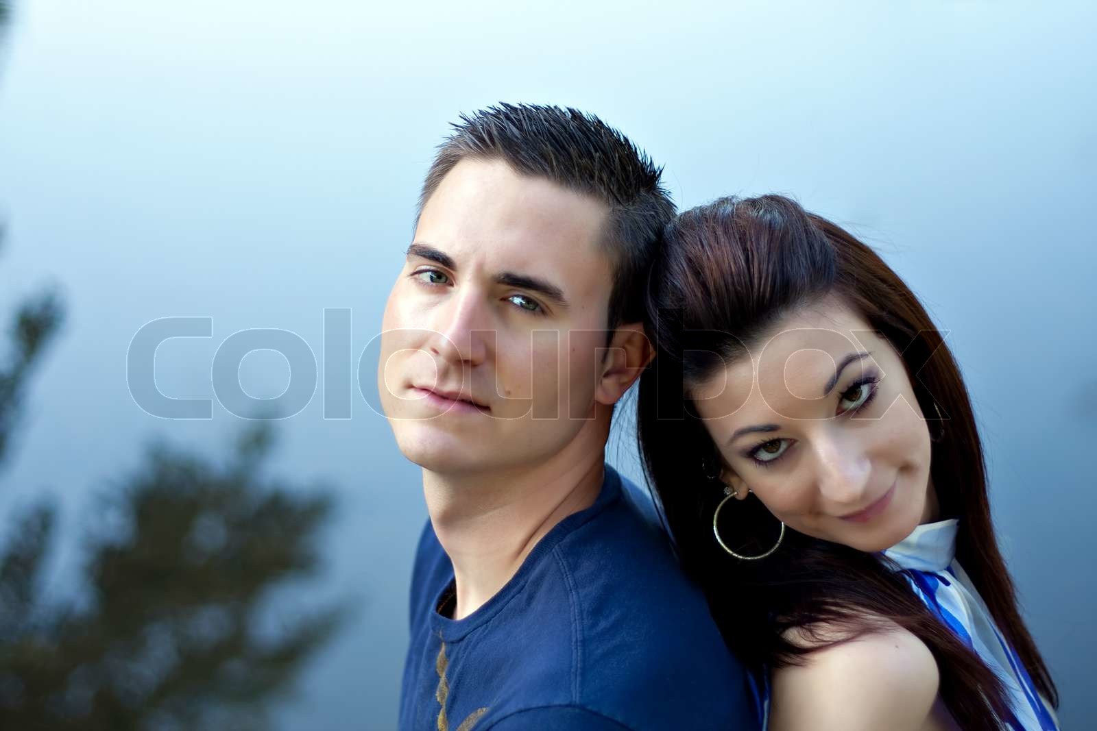a-happy-young-couple-in-their-mid-20s-smiling-with-their-heads-close