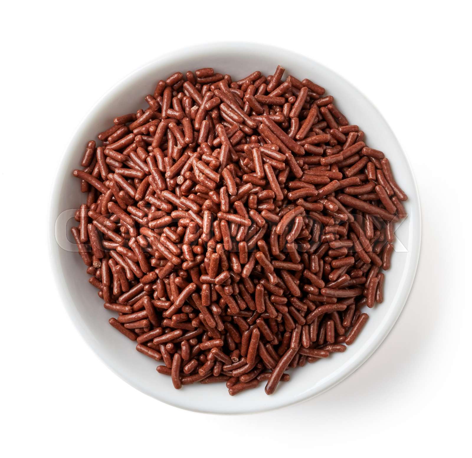Chocolate sprinkles in white bowl isolated on white, from above Stock