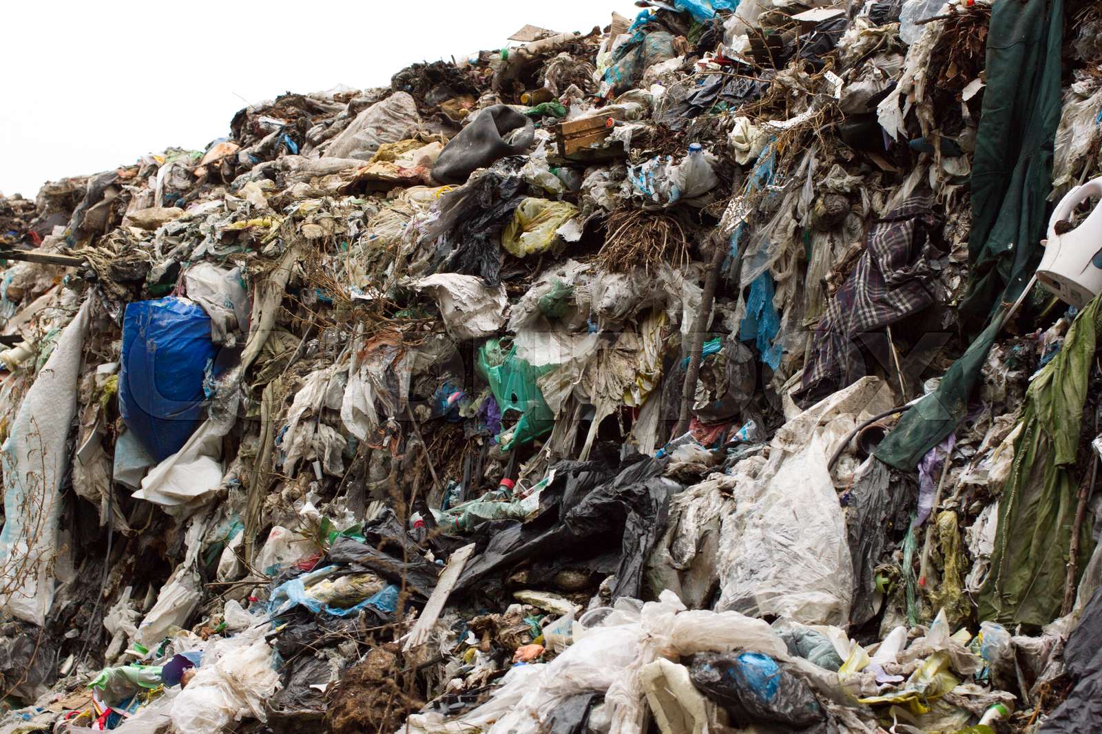 Pile of plastic bags and other refined petroleum products dumped in