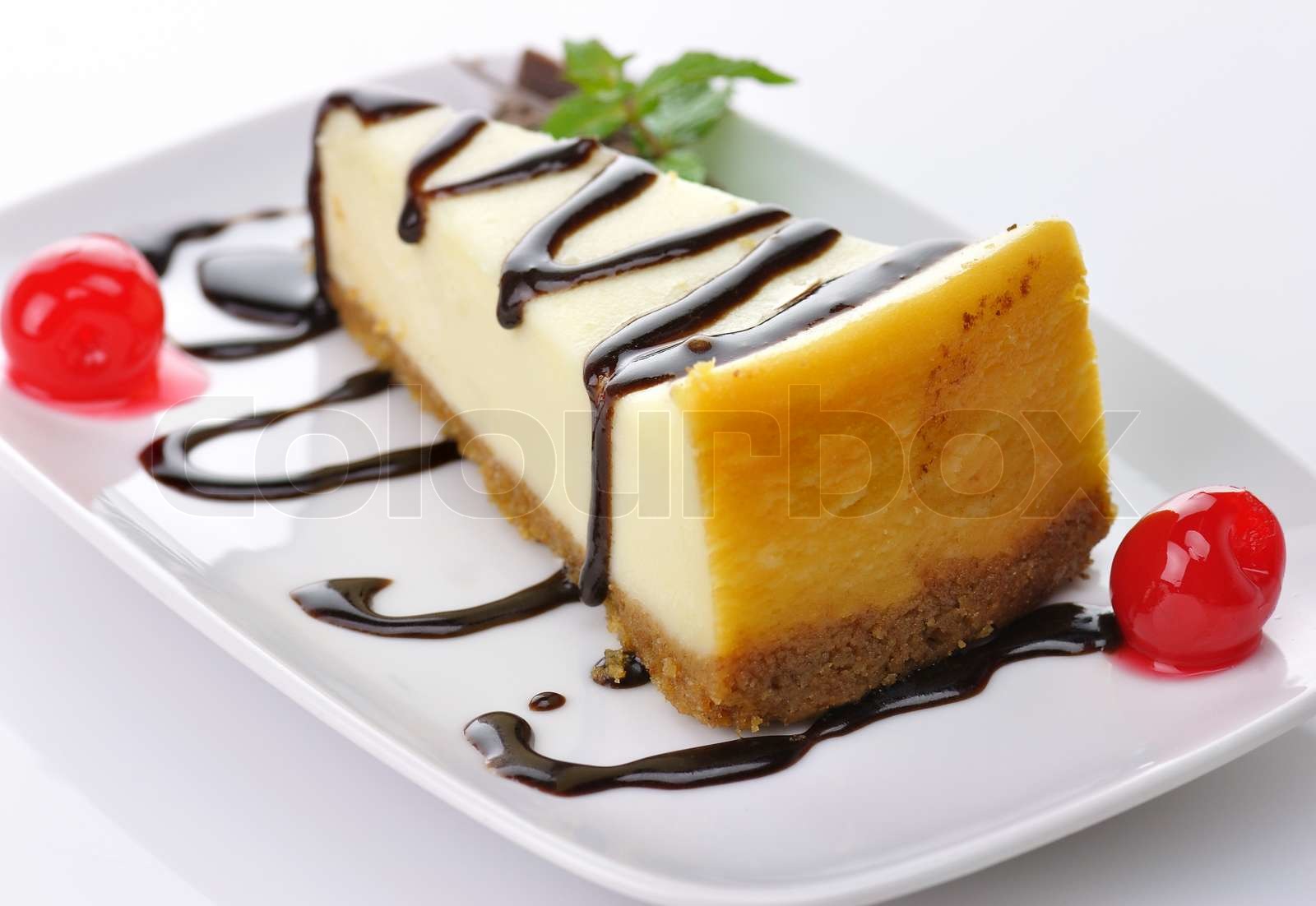 cheesecake with chocolate sauce Stock image Colourbox