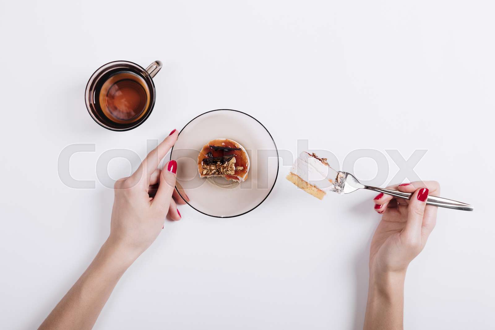 Woman Eating Cake And Drinking Tea Stock Image Colourbox