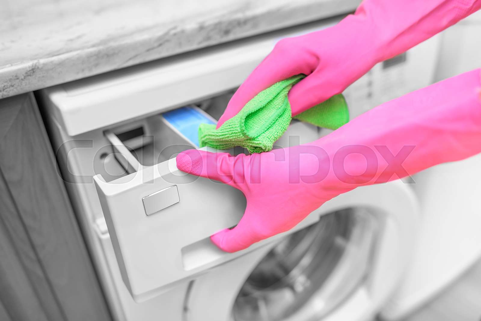 Female hand wash washing machine. Stock image Colourbox