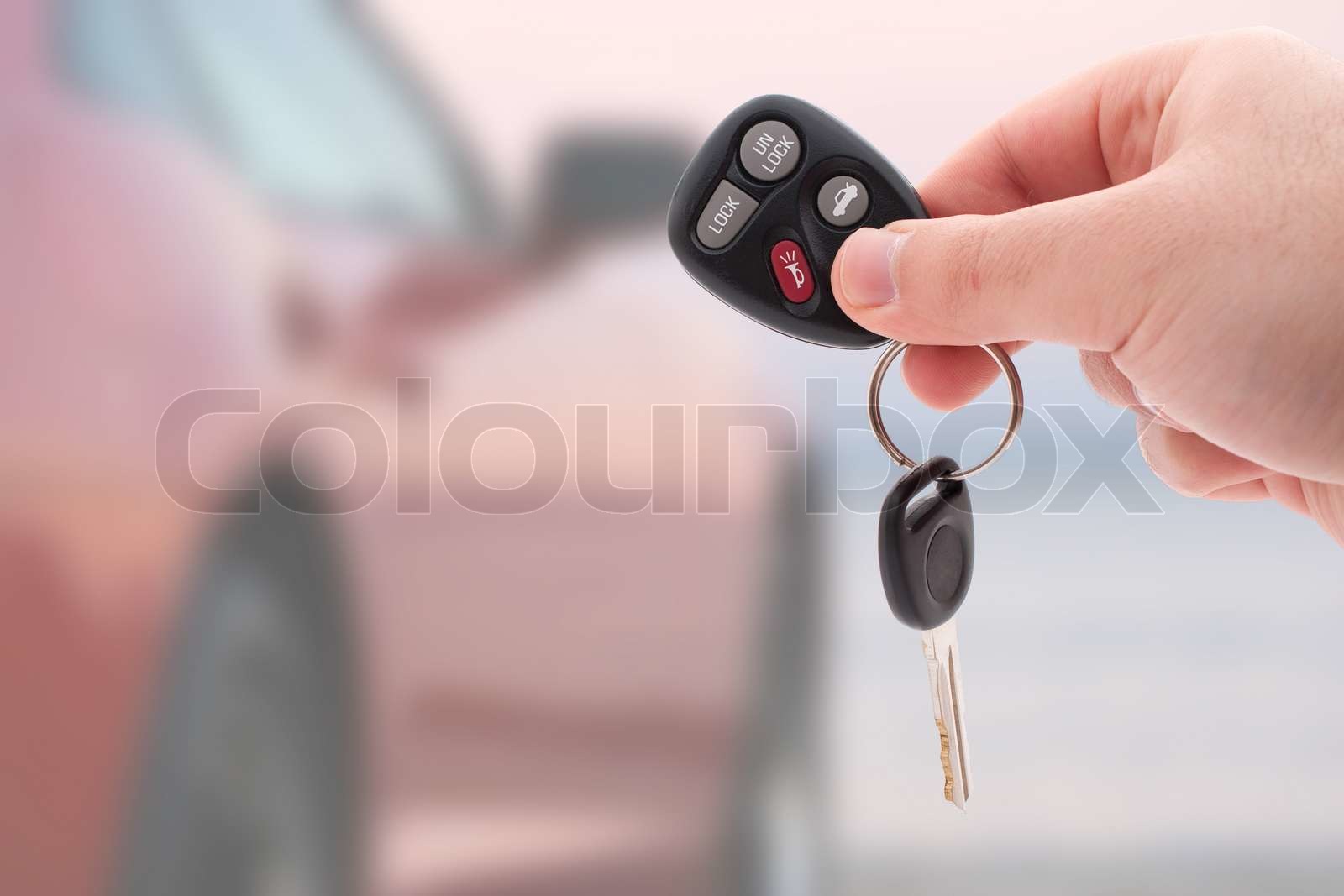 driver confidently holding car keys with insurance documents in hand
