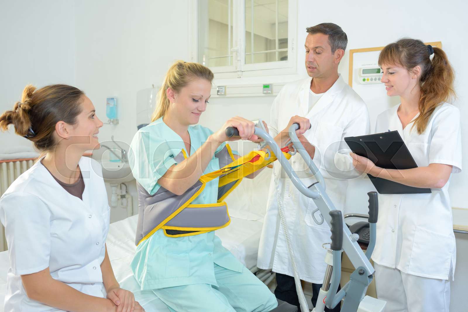 Patient being hoisted from bed | Stock image | Colourbox