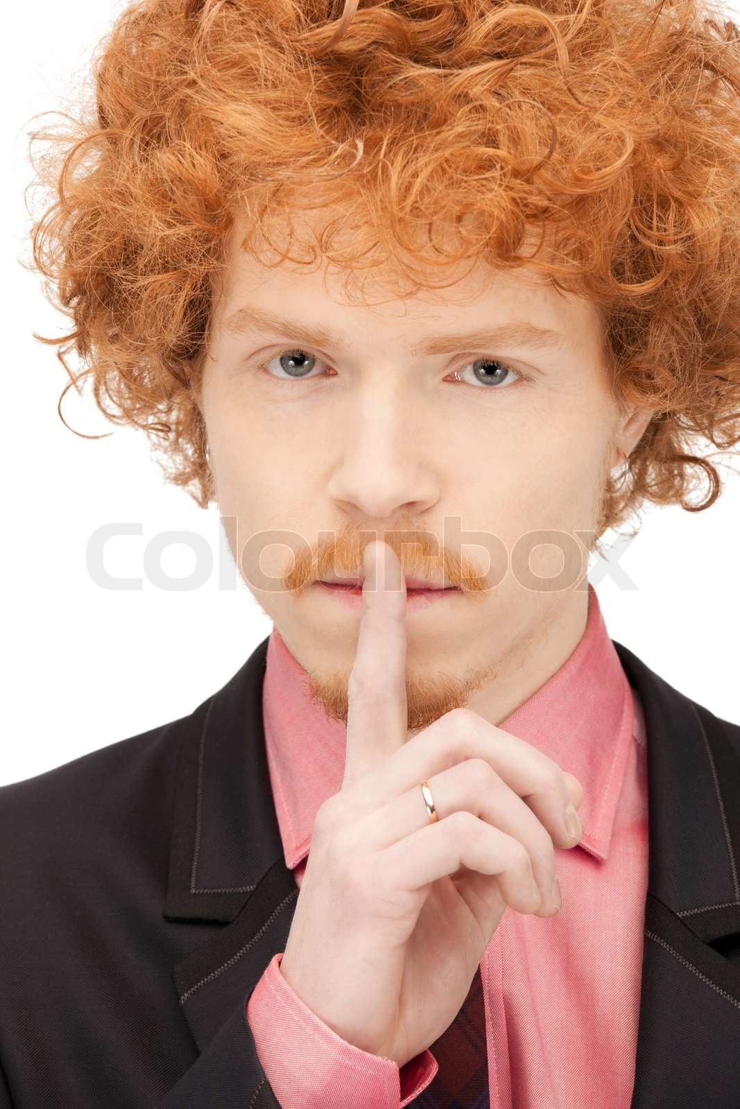 helles Bild der schöne Mann mit dem Finger auf die Lippen Stock Bild Colourbox