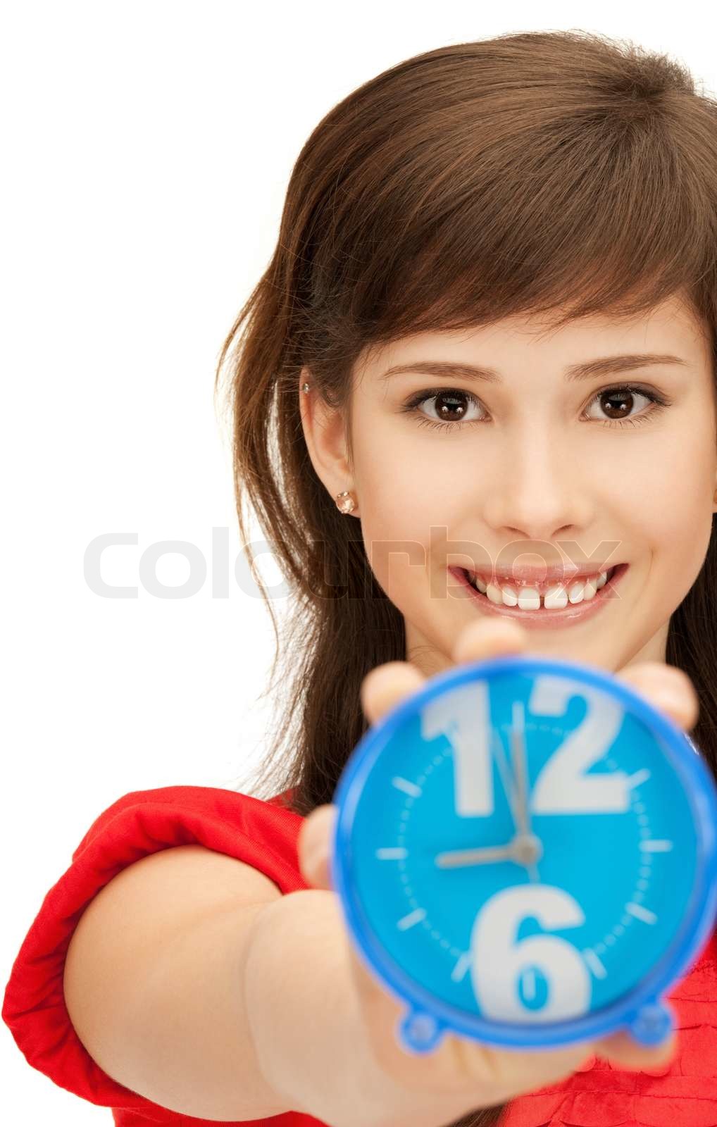 bright picture of teenage girl holding alarm clock Stock image