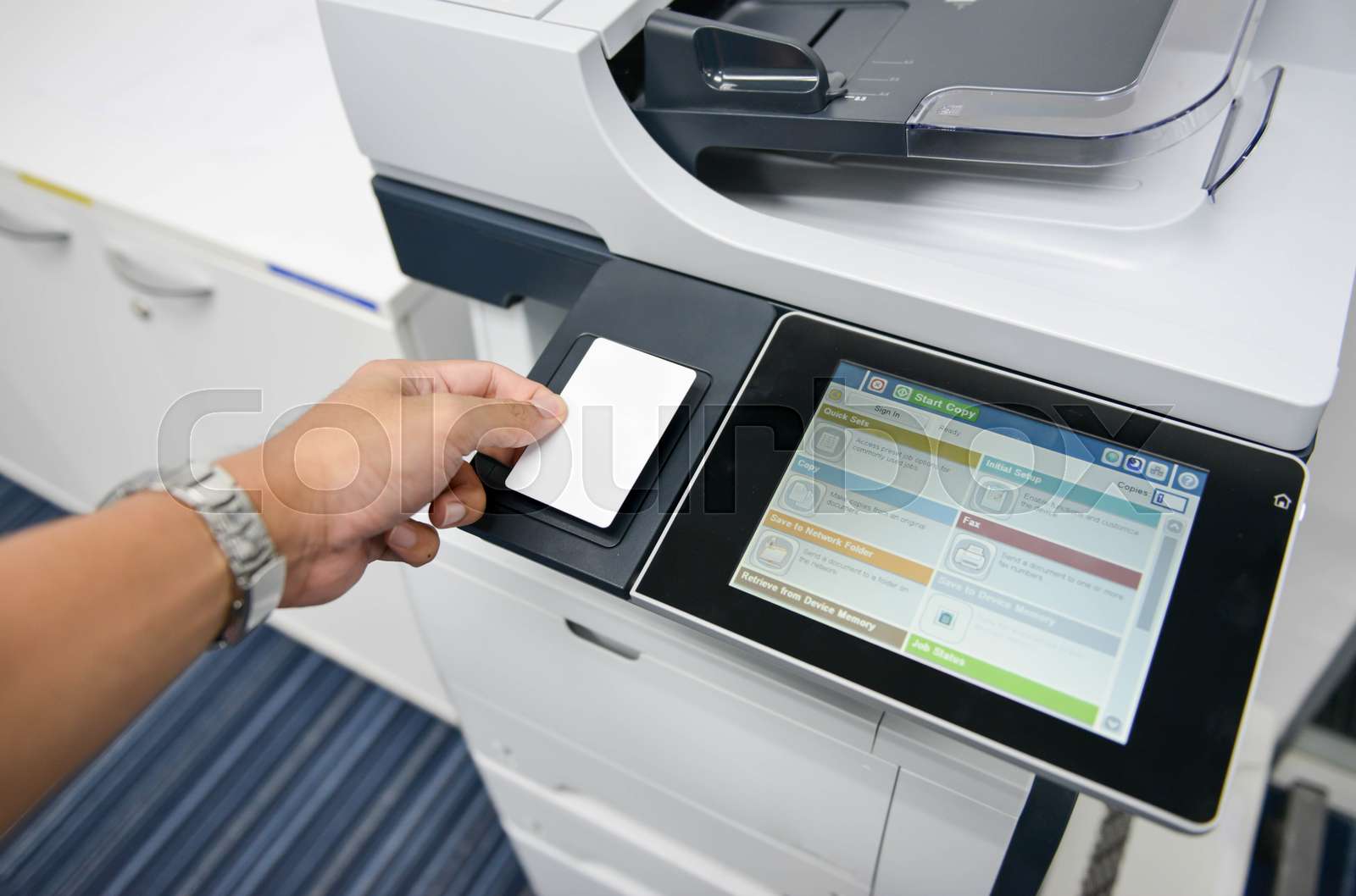 Using the access card on printer to printing the document Stock image