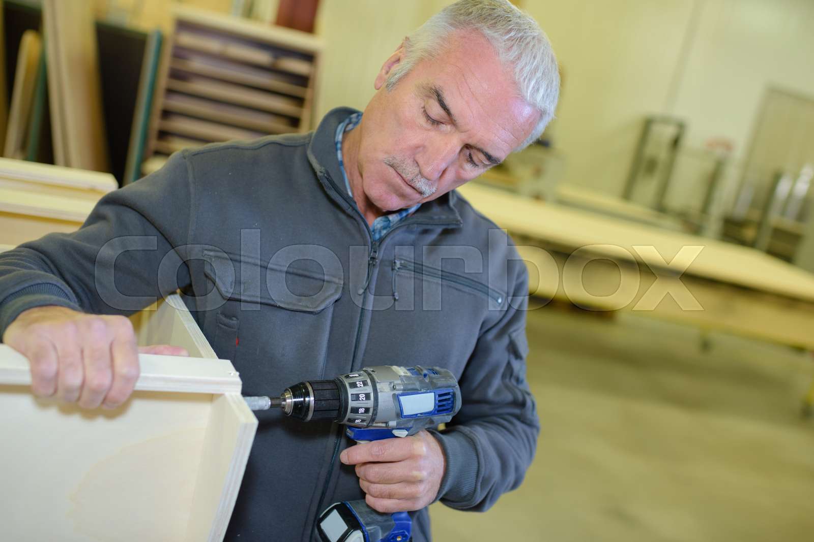 furniture worker working Stock image Colourbox
