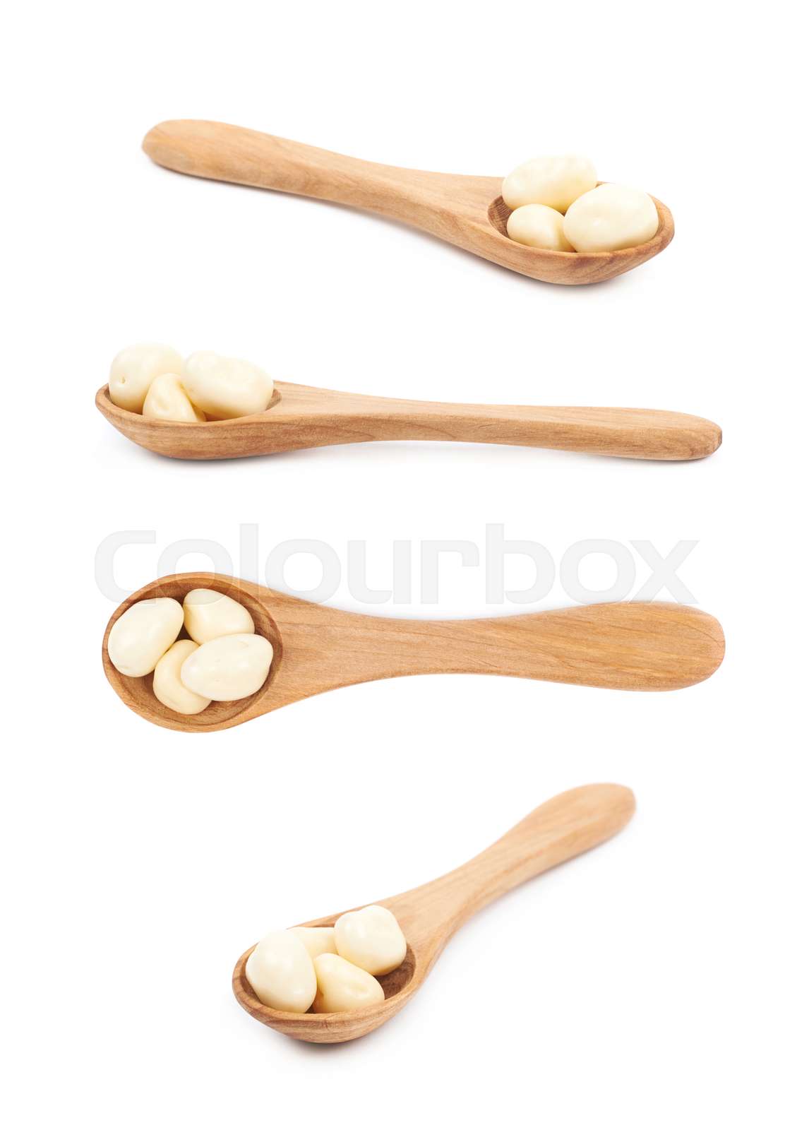 Spoon of chocolate candies isolated | Stock image | Colourbox