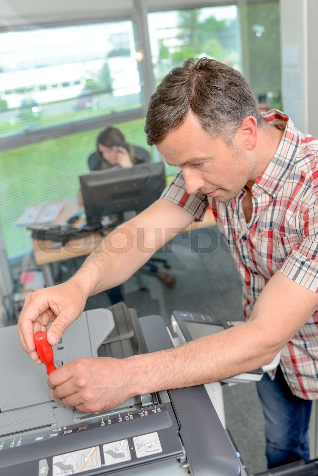 Repairing a printer stock image colourbox