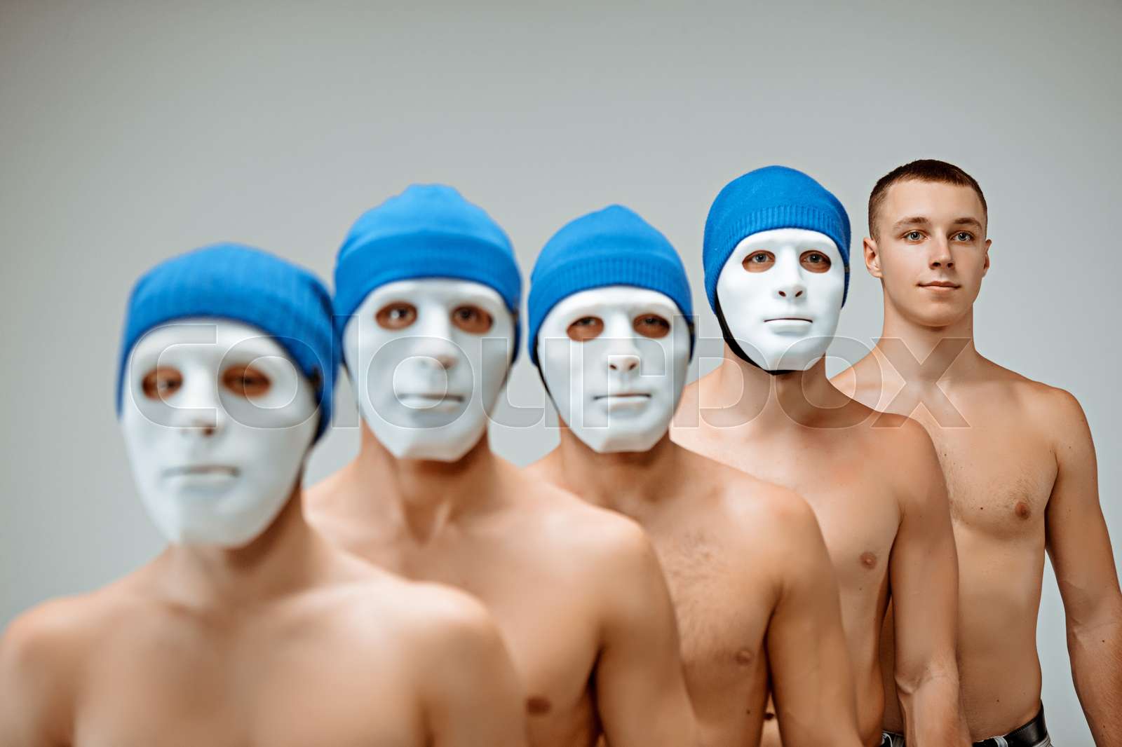 The people in masks and one man without mask | Stock image | Colourbox