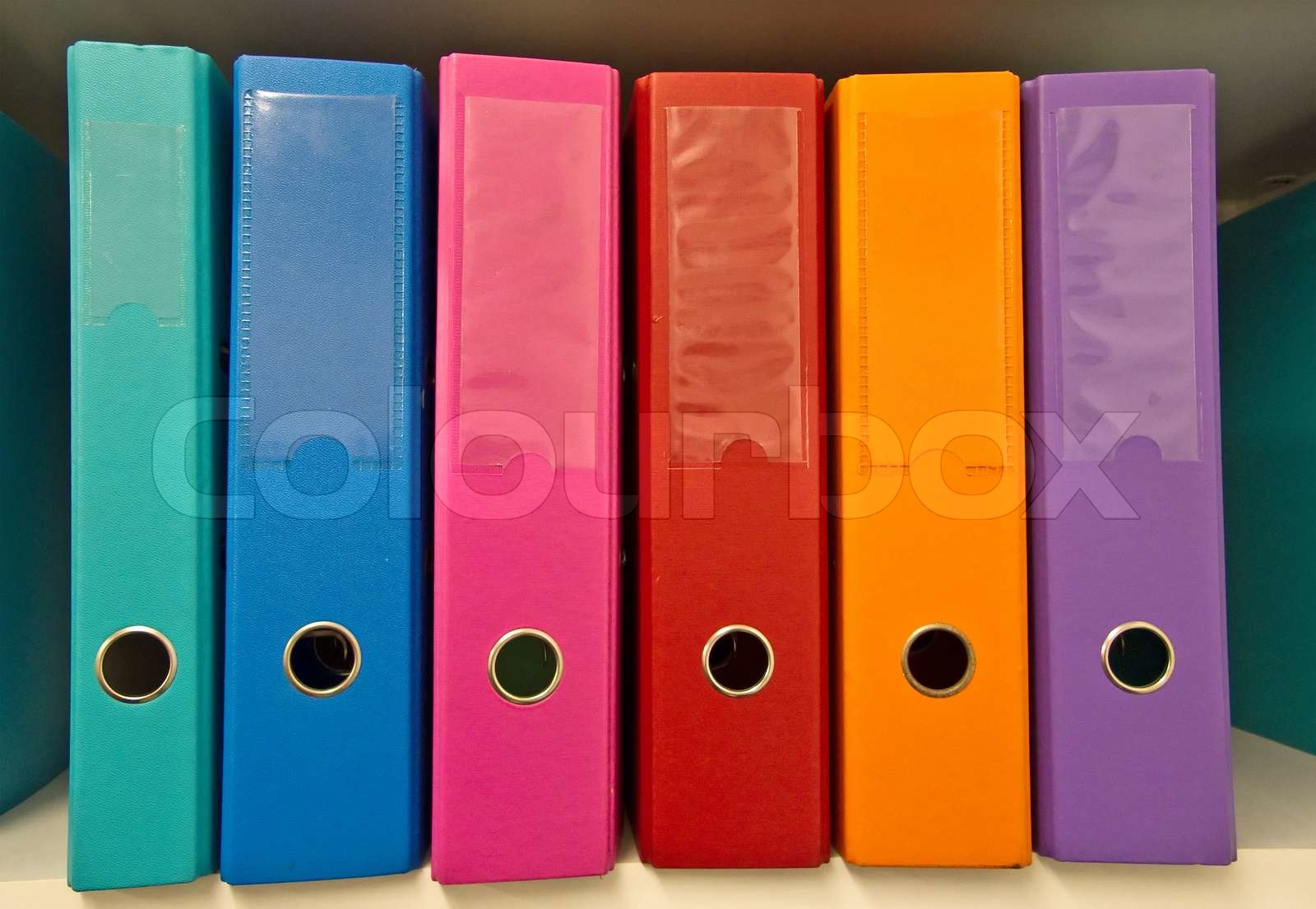 Colorful binders on the shelf Stock image Colourbox