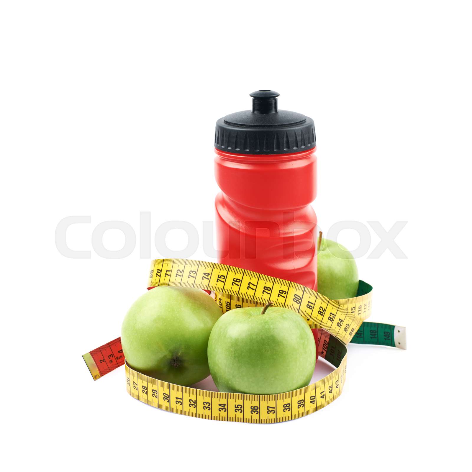Drinking water bottle and apples Stock image Colourbox