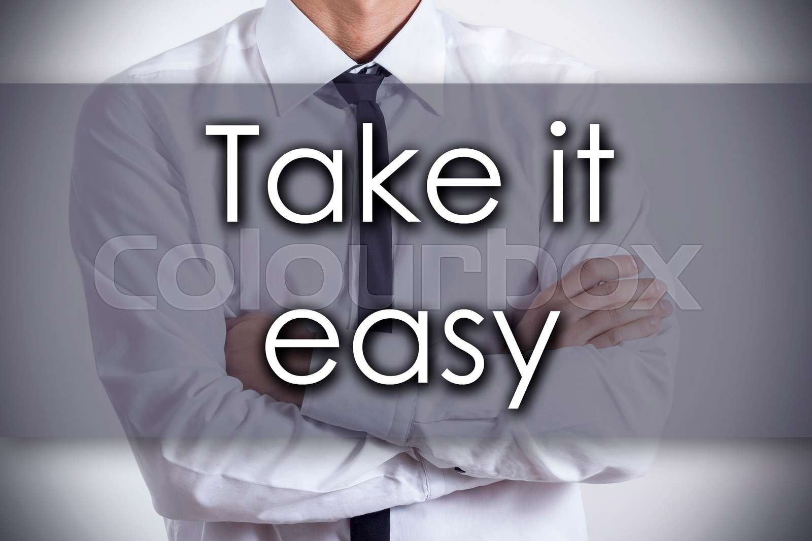 Take it easy - Young businessman with text - business concept | Stock ...