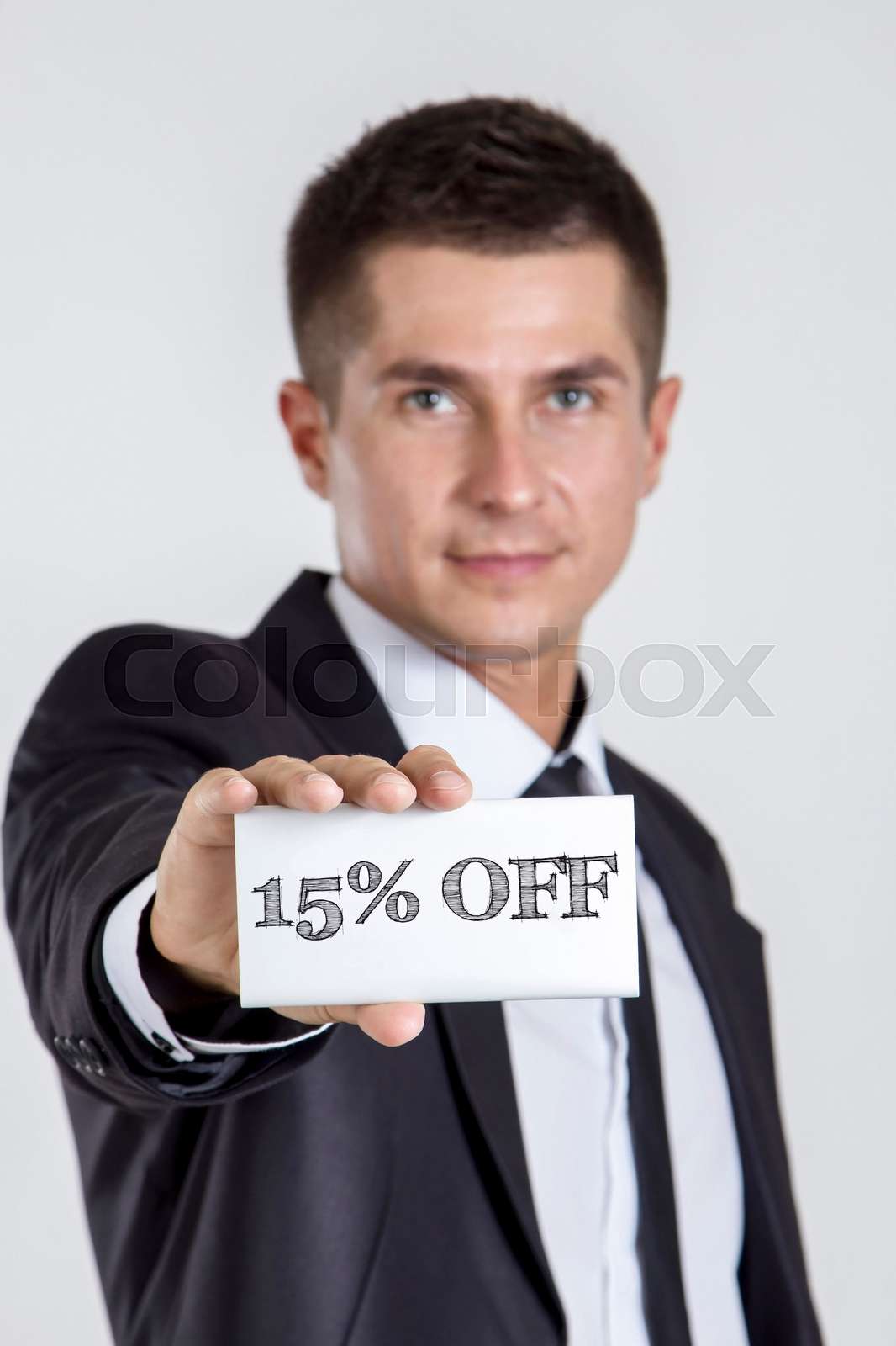 15 Percent OFF Young Businessman Holding A White Card With Text