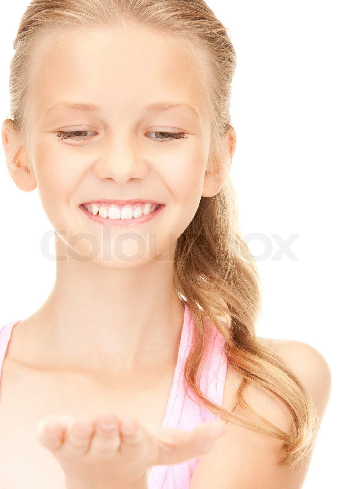 Lovely girl holding something on the palm of her hand stock image