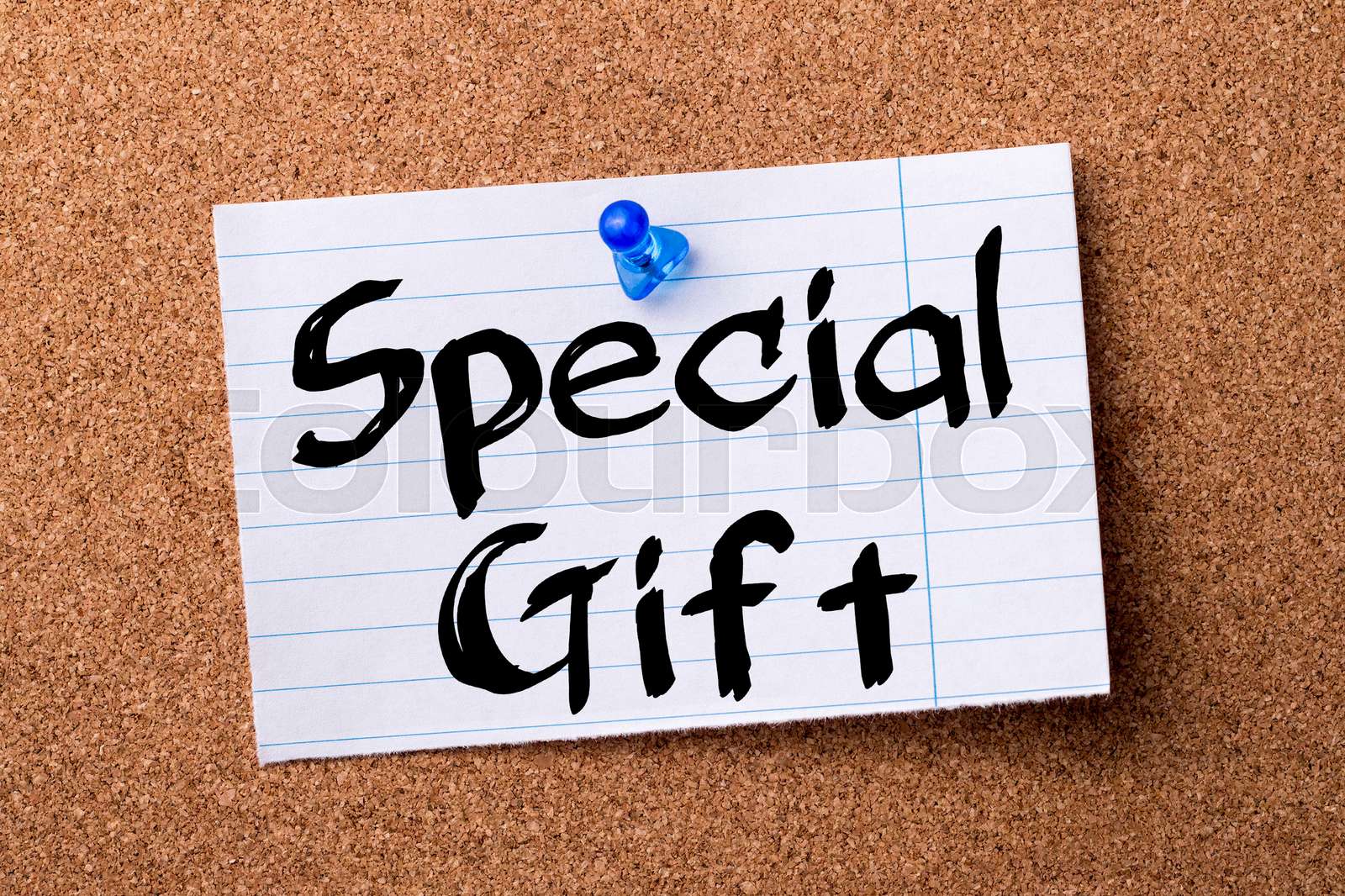 special-gift-teared-note-paper-pinned-on-bulletin-board-stock-image