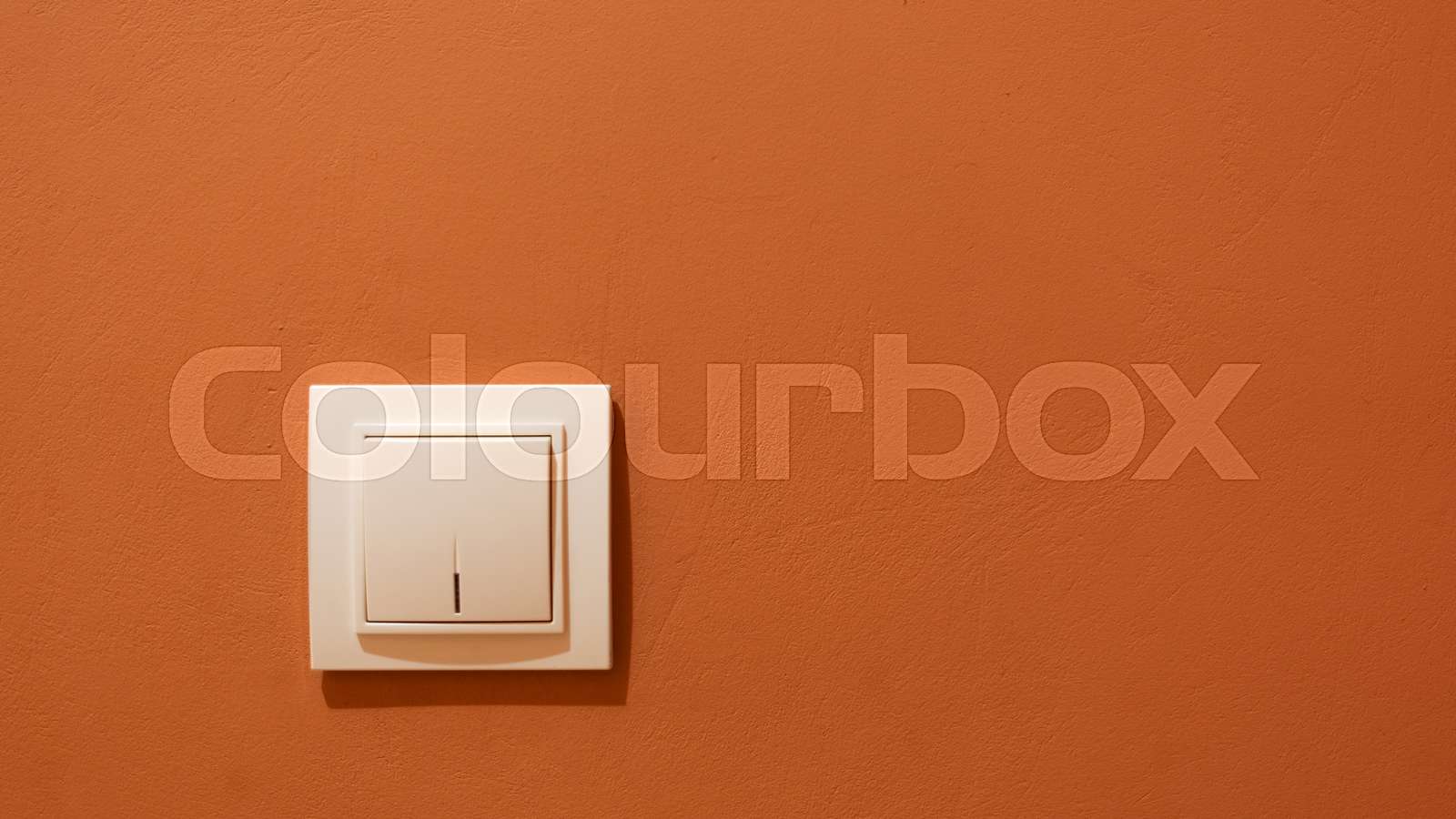White switch button on the wall. Electrical light switch on the wall ...