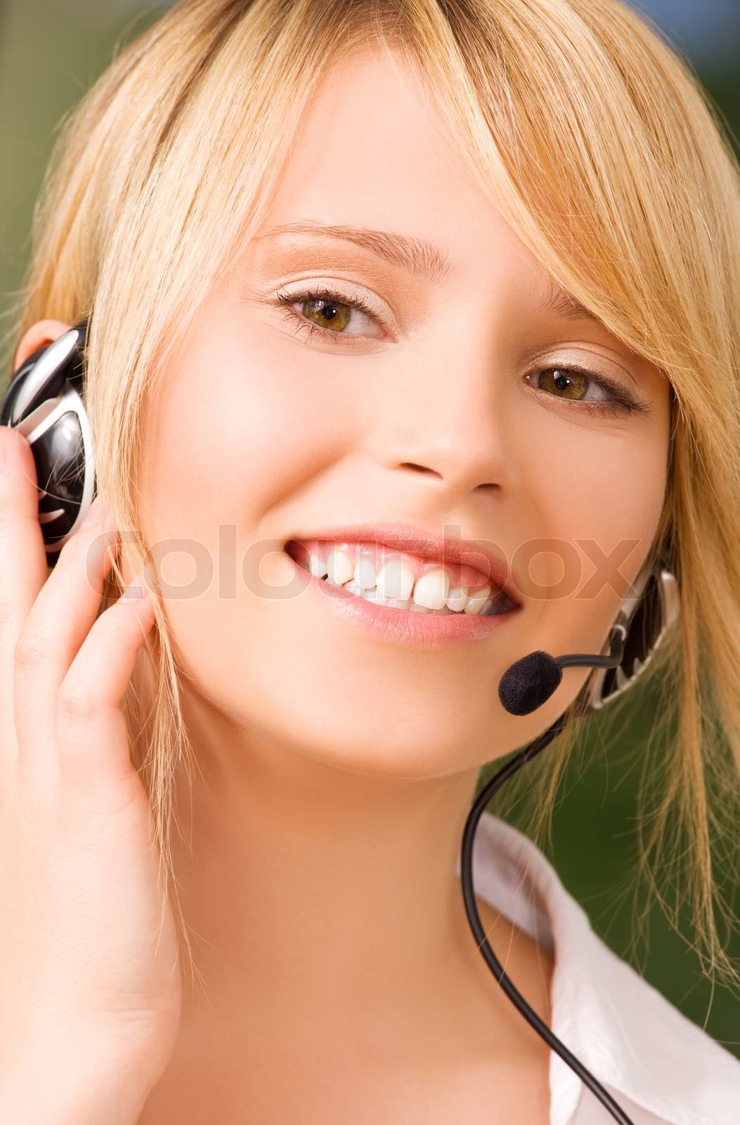 Bright Picture Of Friendly Female Helpline Operator Stock Image