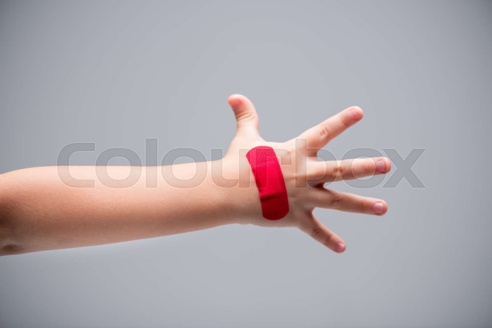 Red patch on hand | Stock image | Colourbox