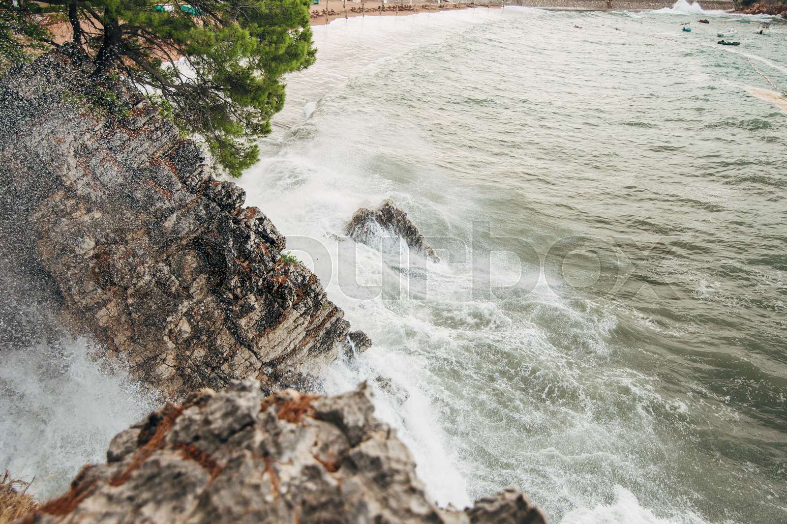 Rocks sticking out of the water and the waves washed | Stock image ...