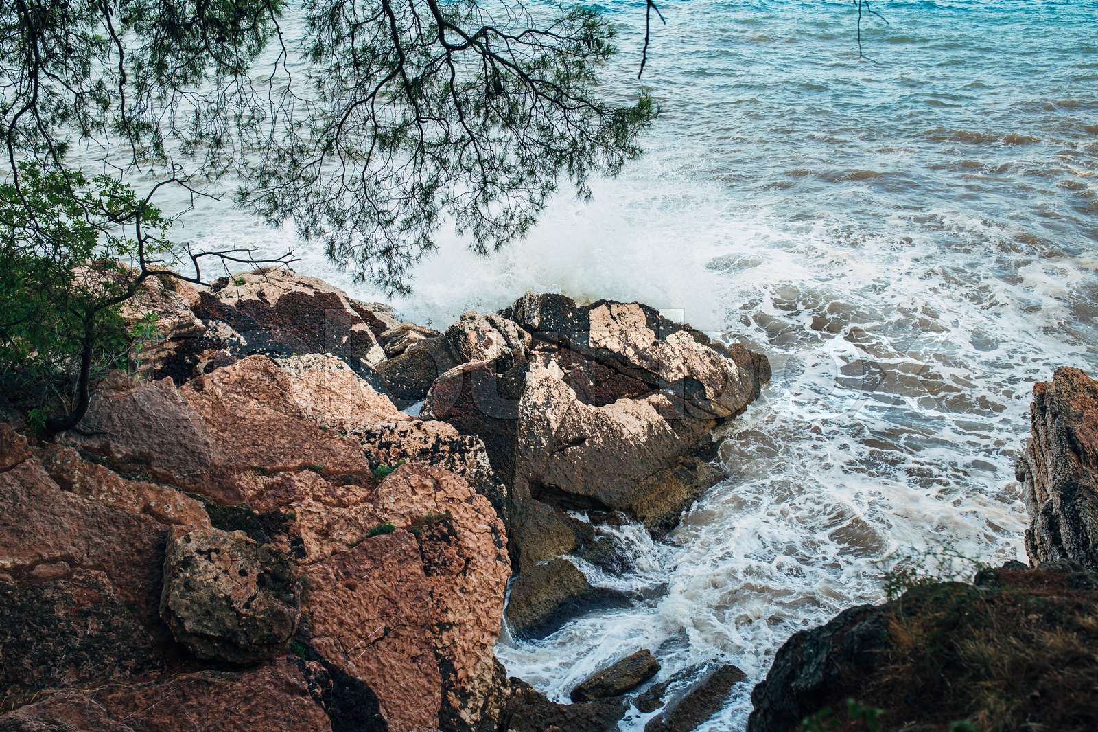 Rocks sticking out of the water and the waves washed | Stock image ...