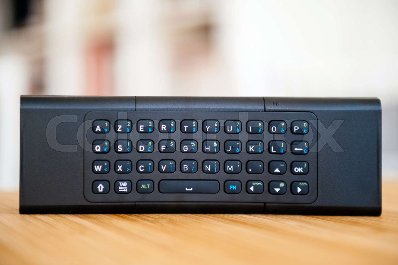 Modern remote control with full qwerty keyboard Stock image Colourbox
